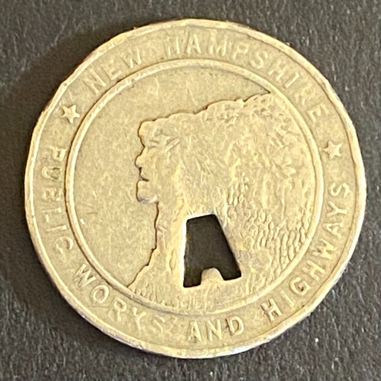 New Hampshire Public Works and Highways Transit Token w/ "A" Punch Out 16mm (#1)