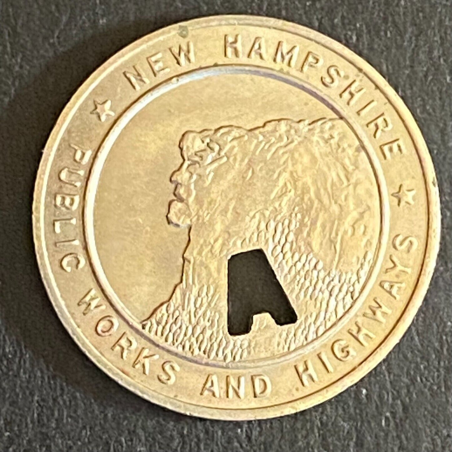 New Hampshire Public Works and Highways Transit Token w/ "A" Punch Out 16mm (#3)