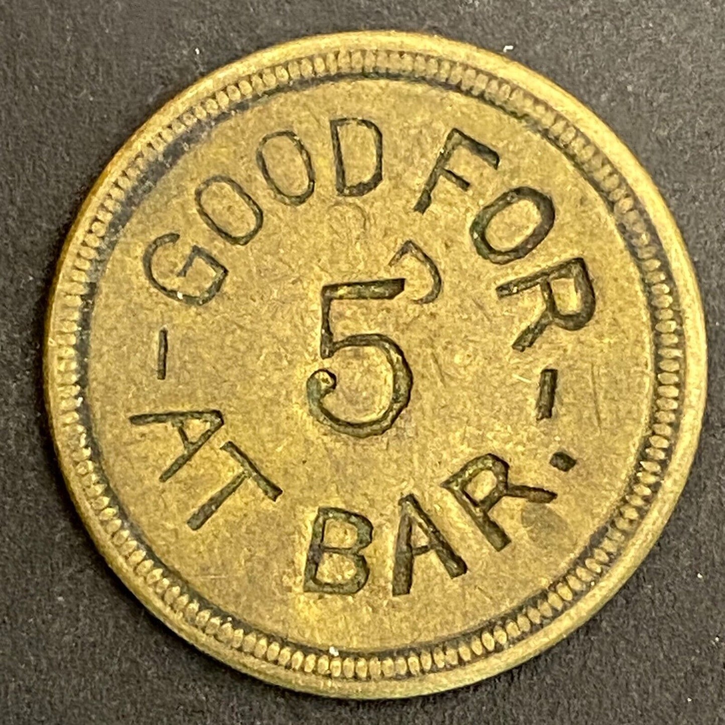 M J E "Good For 5 At Bar" Incuse Brass Maverick Trade Token 23mm