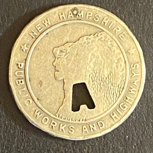 New Hampshire Public Works and Highways Transit Token w/ "A" Punch Out 16mm (#1)
