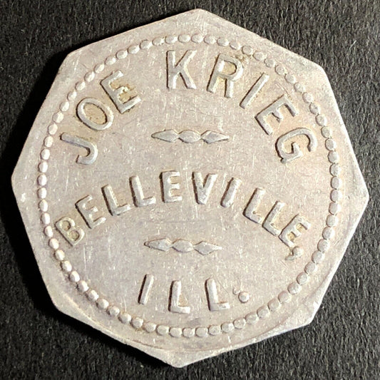 Joe Krieg Belleville, IL Alum. G/F 5c Trade Token Hexagon c1920's-40's 25mm