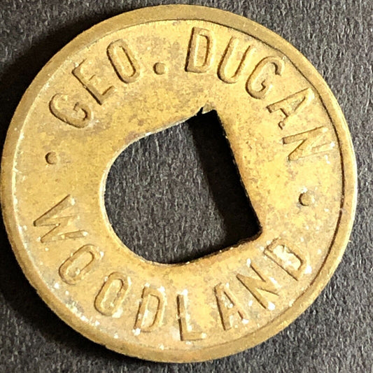 Geo. Dugan Woodland (CA Cigars Billiards) Brass G/F 5c Trade Token c1920s 21mm