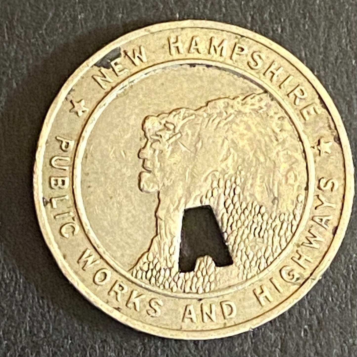 New Hampshire Public Works and Highways Transit Token w/ "A" Punch Out 16mm (#2)