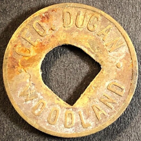Geo. Dugan Woodland (CA Cigars Billiards) Brass G/F 5c Trade Token 21mm c1920s