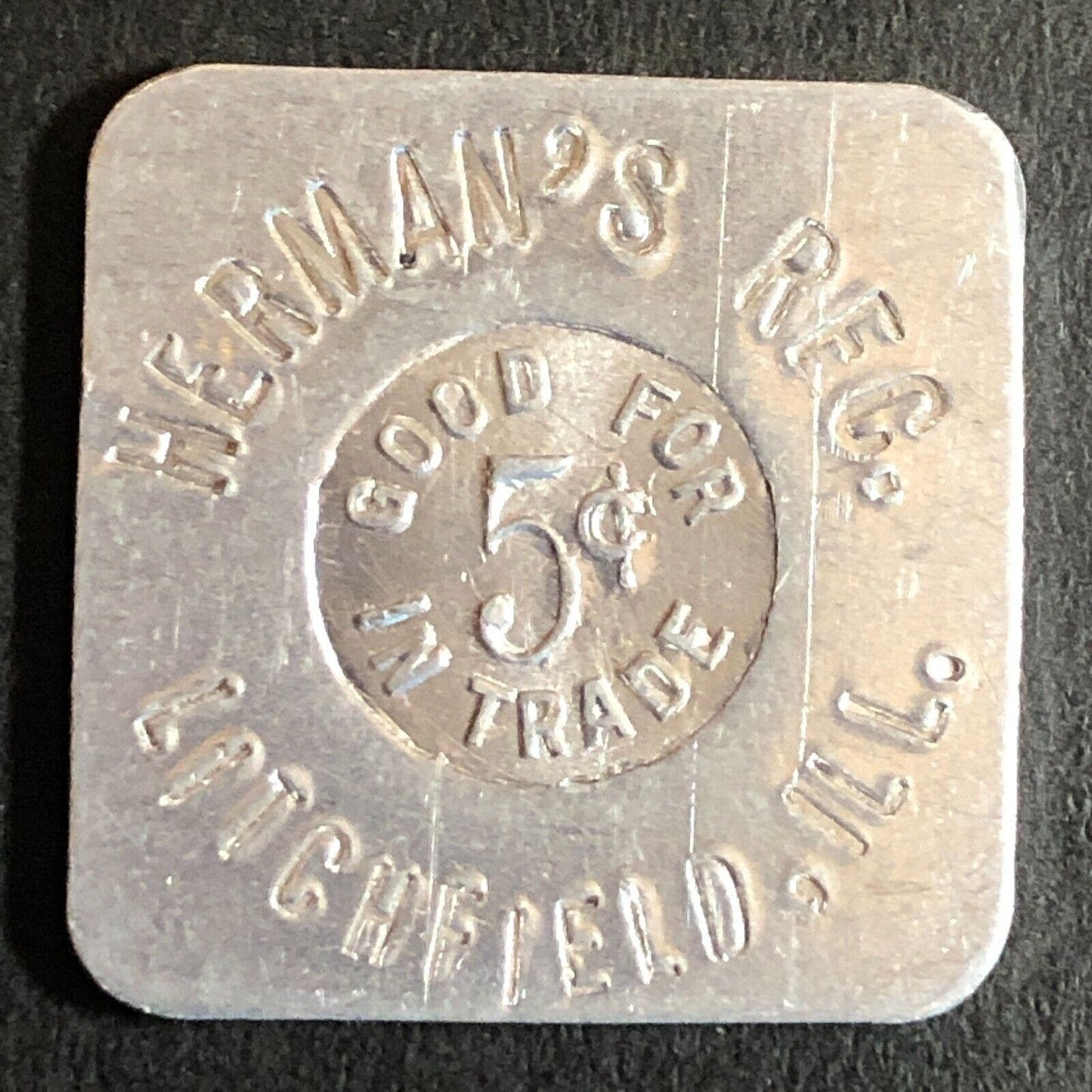 Herman's RFC. Litchfield, IL / A.E. Schmidt Alum G/F 5c Trade Token 24mm Scarce