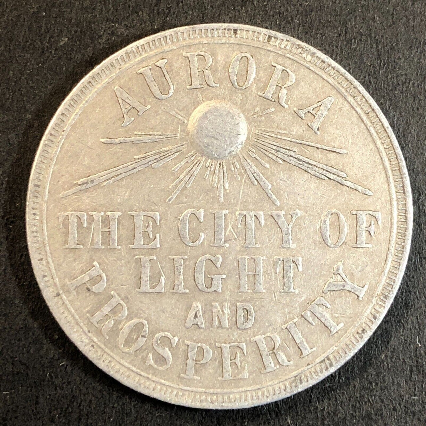 Aurora The City of Light & Prosperity Mayor Fred Fauth Alum Token 34mm 1909-10