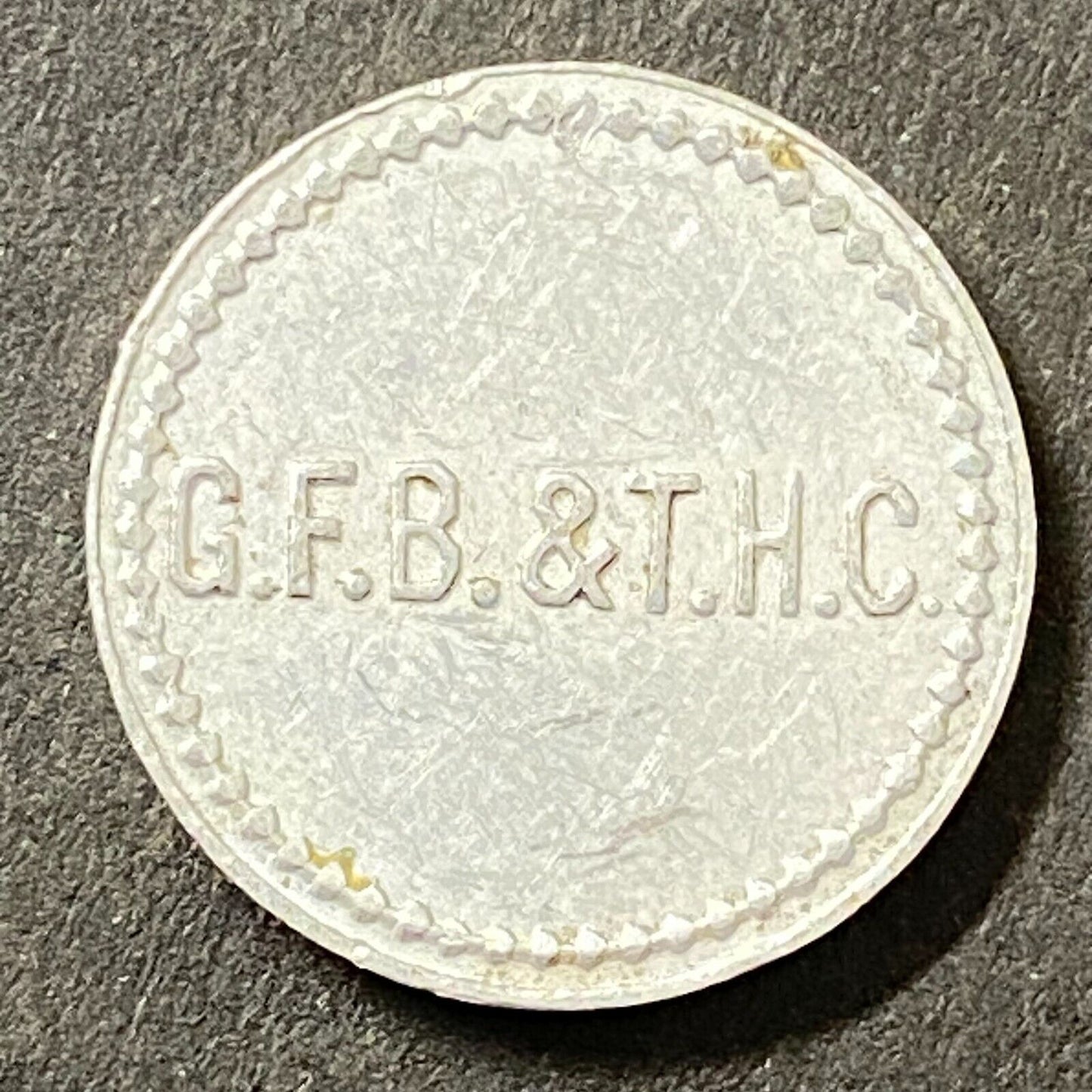 G.F.B. & T.H.C. G/F 2 1/2¢ Alum Trade Token 18mm Maverick