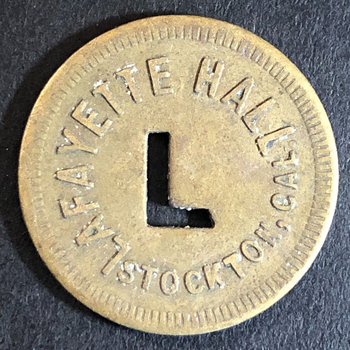 Lafayette Hall Stockton, CA Brass Trade Token "L" Cutout 24mm Scarce