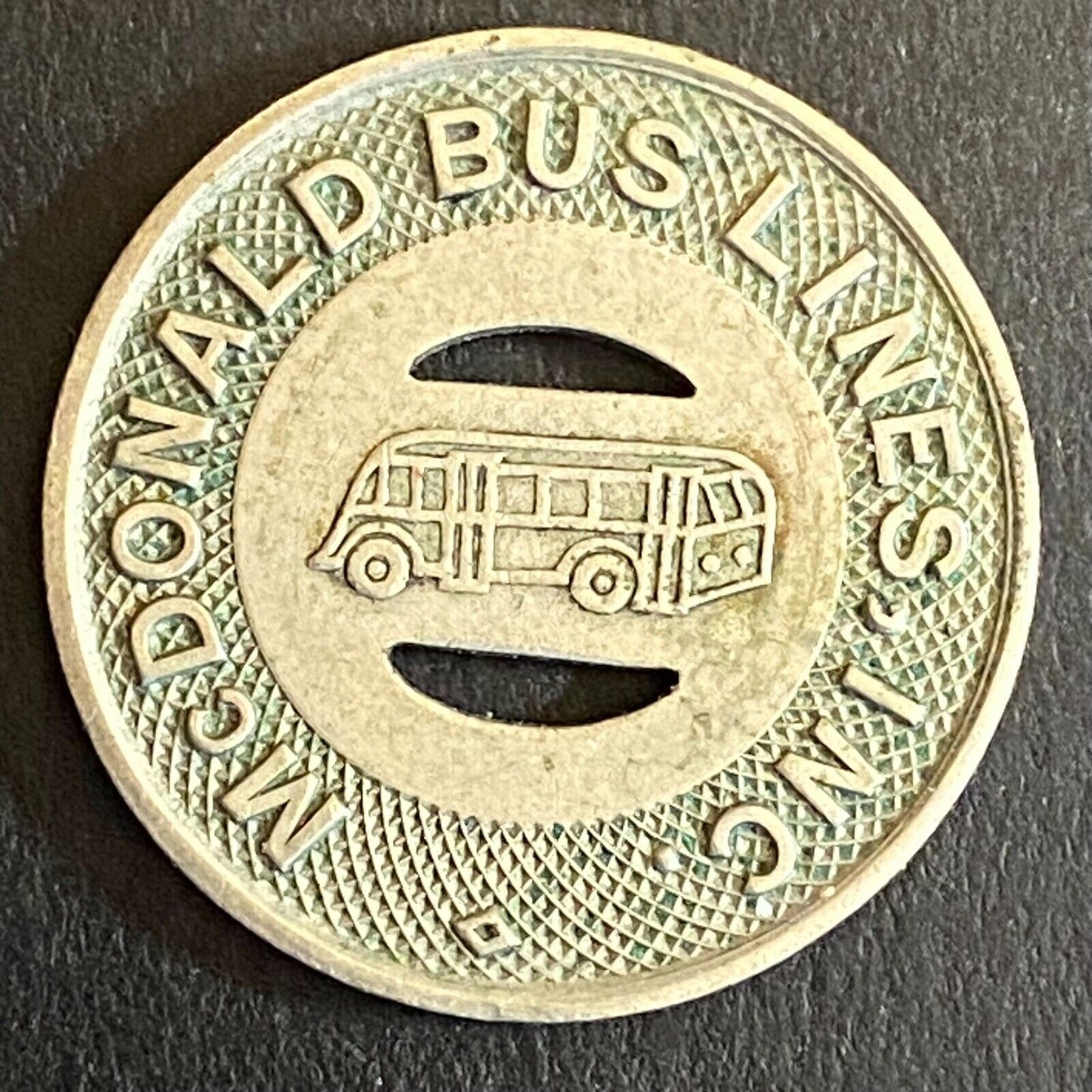 McDonald Bus Lines (Girald, OH) G/F One 15c Fare Transit WM Token 23mm