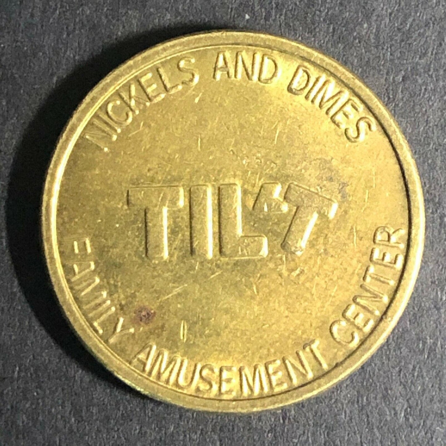 20.35mm Tilt Family Amusement Center Brass Arcade Token - Fauver Collection