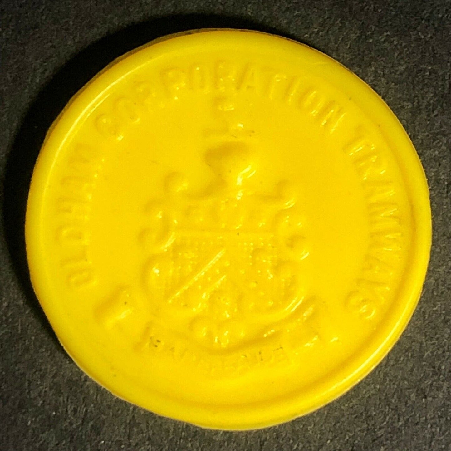 Oldham Transport England Plastic Token Yellow 1D 22mm c50's-60's