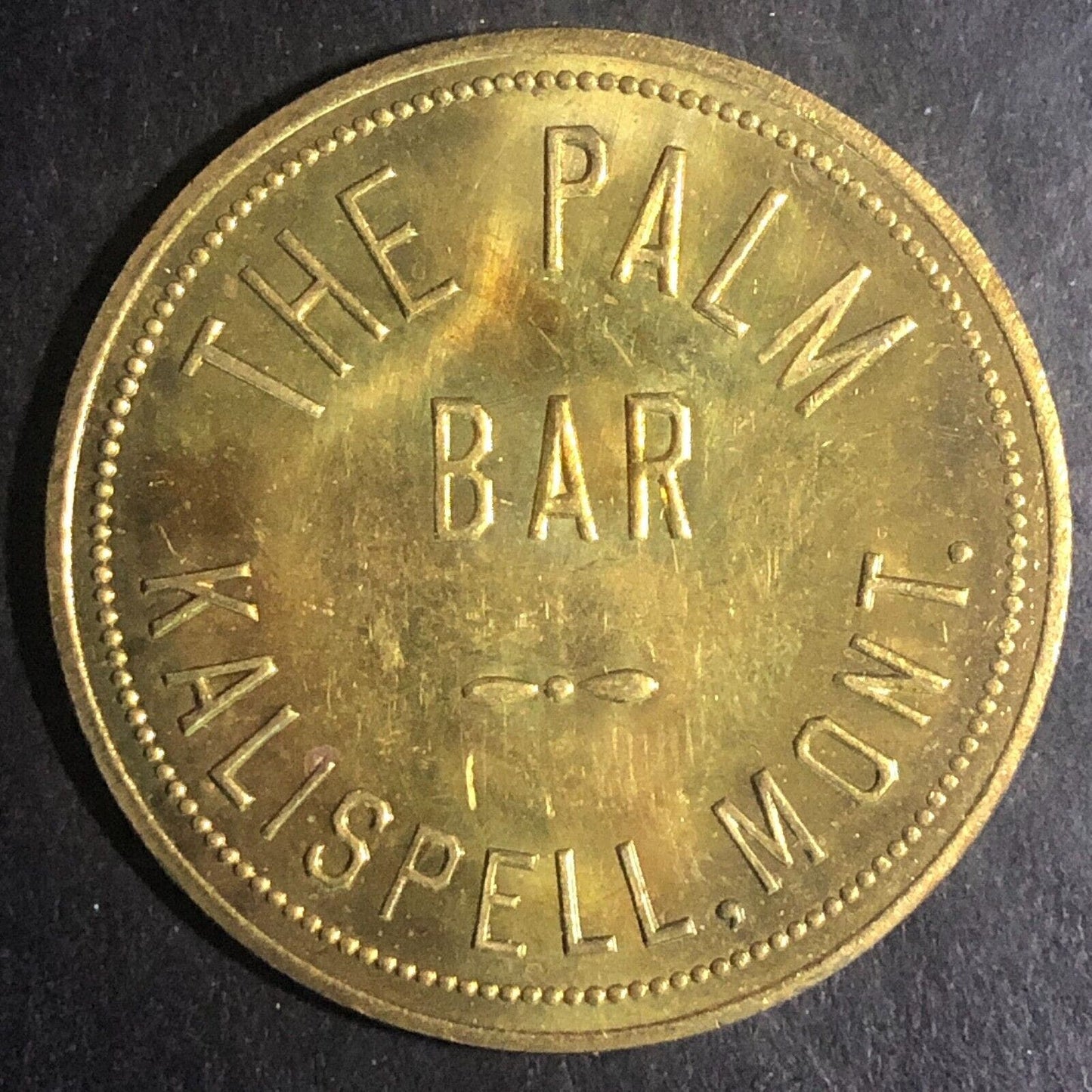 The Palm Bar Kalispell, MO $1.00 In Trade Token Brass c1940's-50's 35mm
