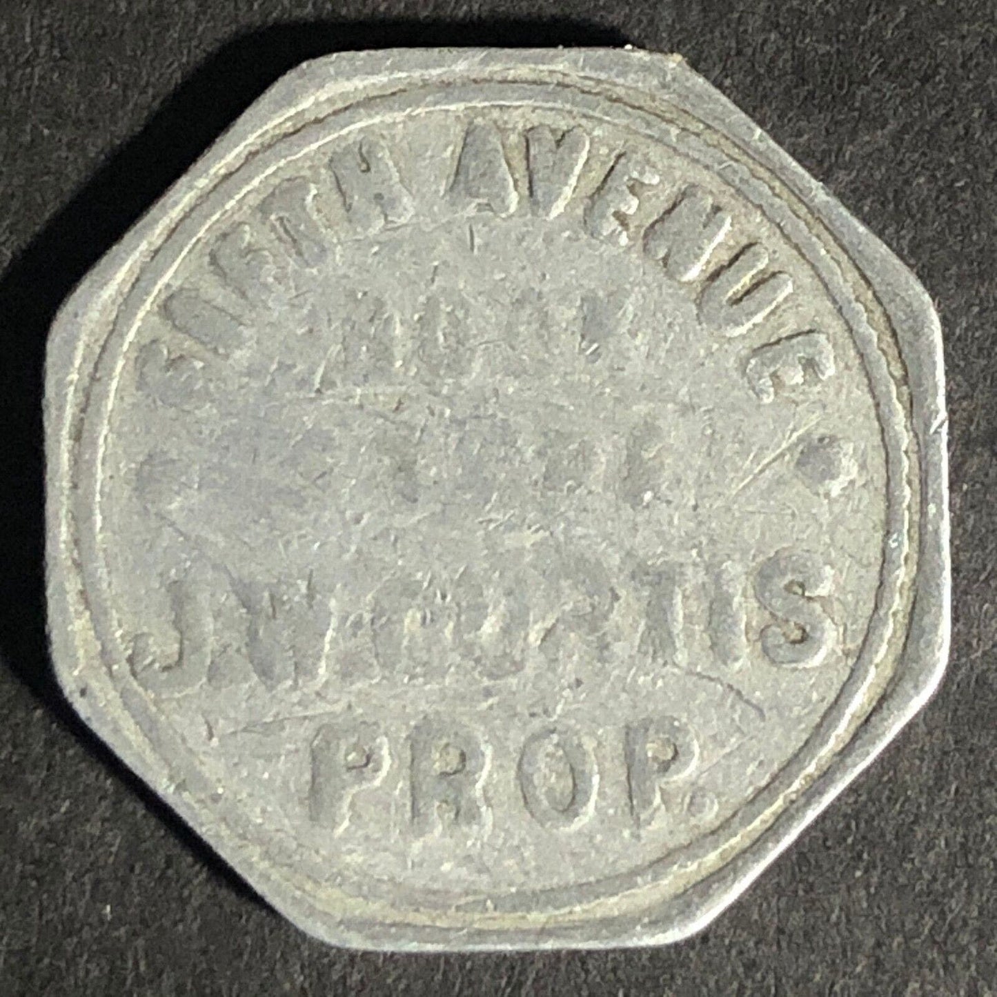Fifth Avenue Book Store J.W. Curtis "10" Octagon Alum. Token 22.7mm Scarce
