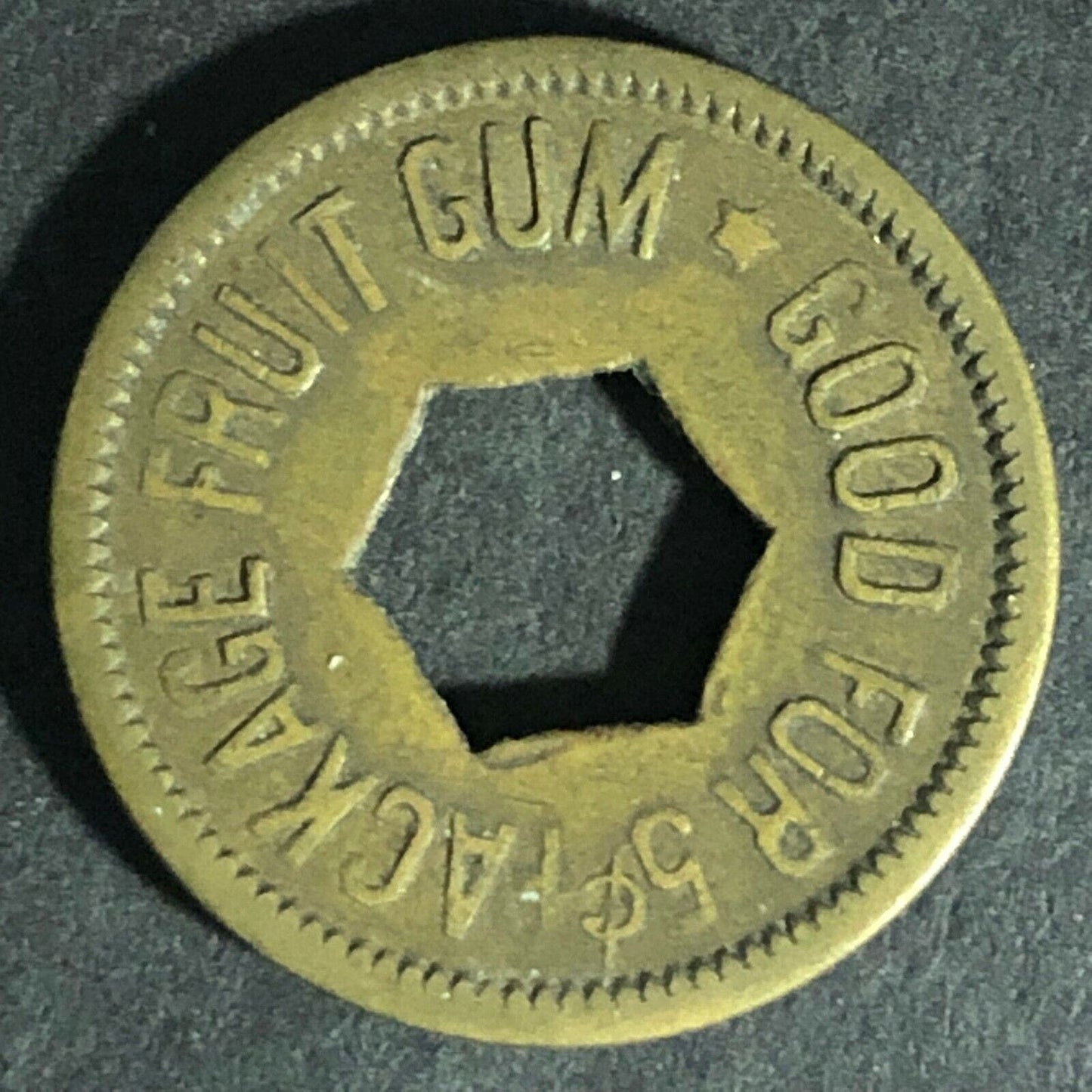 "Good For 5c Package Fruit Gum" Token (Watling Mfg Chicago) Hexagon Cut 21.26mm