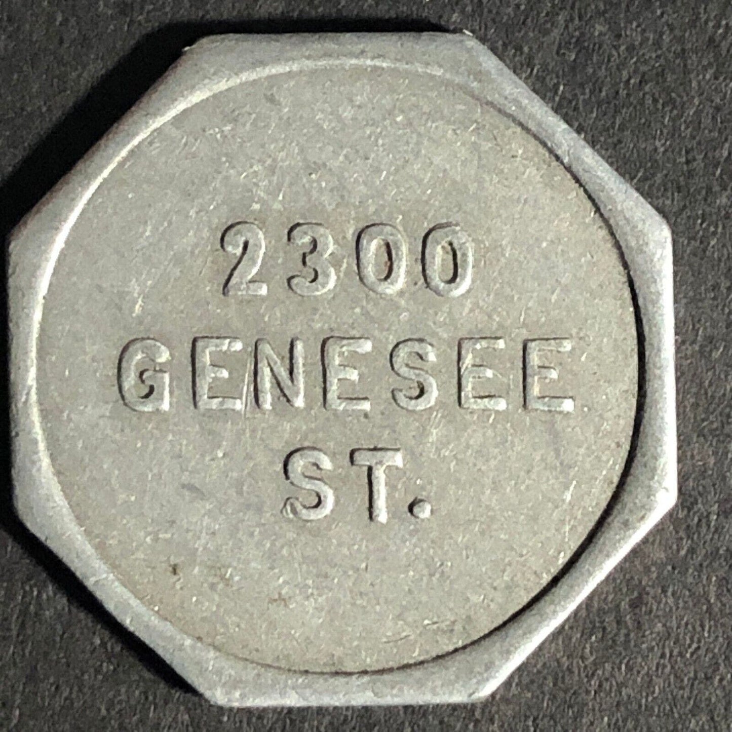 A.C. Gibson Co. 2300 Genesee St. Buffalo Alum. Receipt Token Octagon 22.61mm