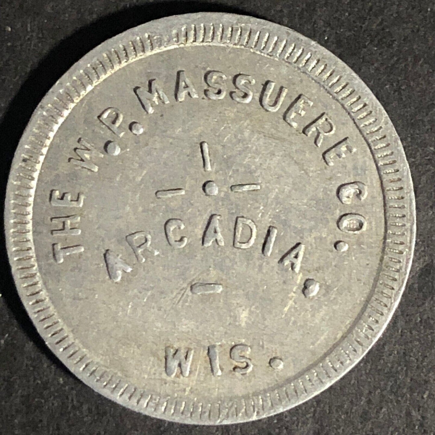 W.P. Massuere Co. Arcadia, Wis. G/F 25c In Merchandise Aluminum Token - 25.7mm