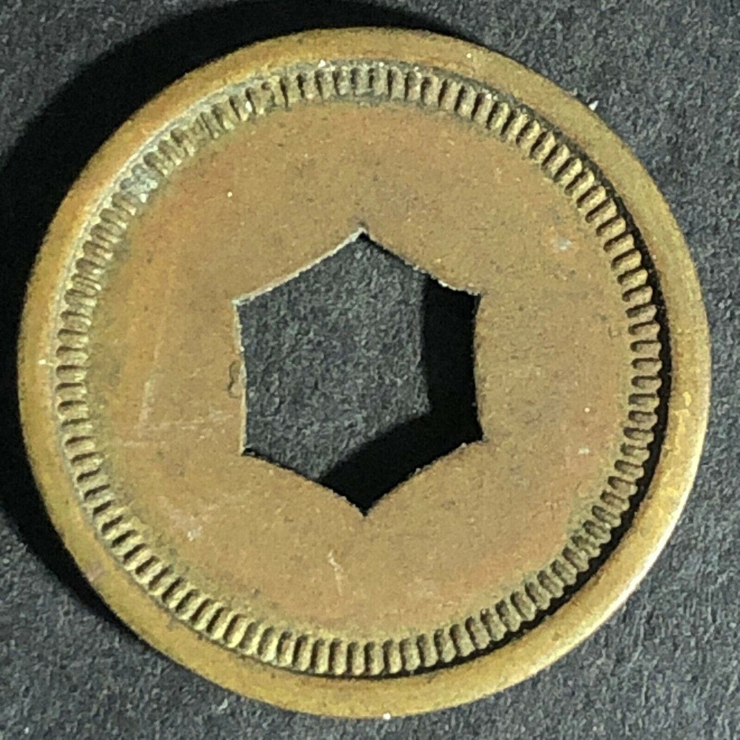 "Good For 5c Package Fruit Gum" Token (Watling Mfg Chicago) Hexagon Cut 21.25mm