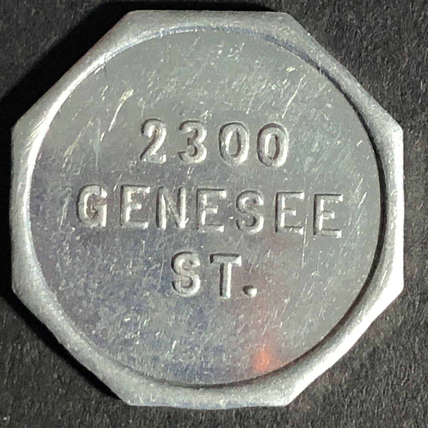 A.C. Gibson Co. 2300 Genesee St. Buffalo Alum. Receipt Token Octagon - 22.77mm
