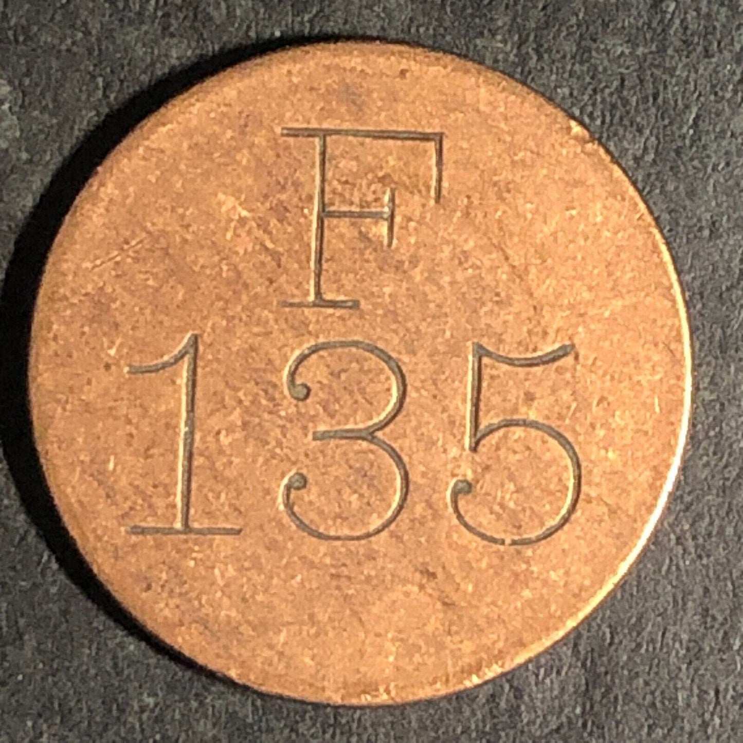 "F 135" "In $1.00 In Trade" Brass Token 17.65mm - Unknown