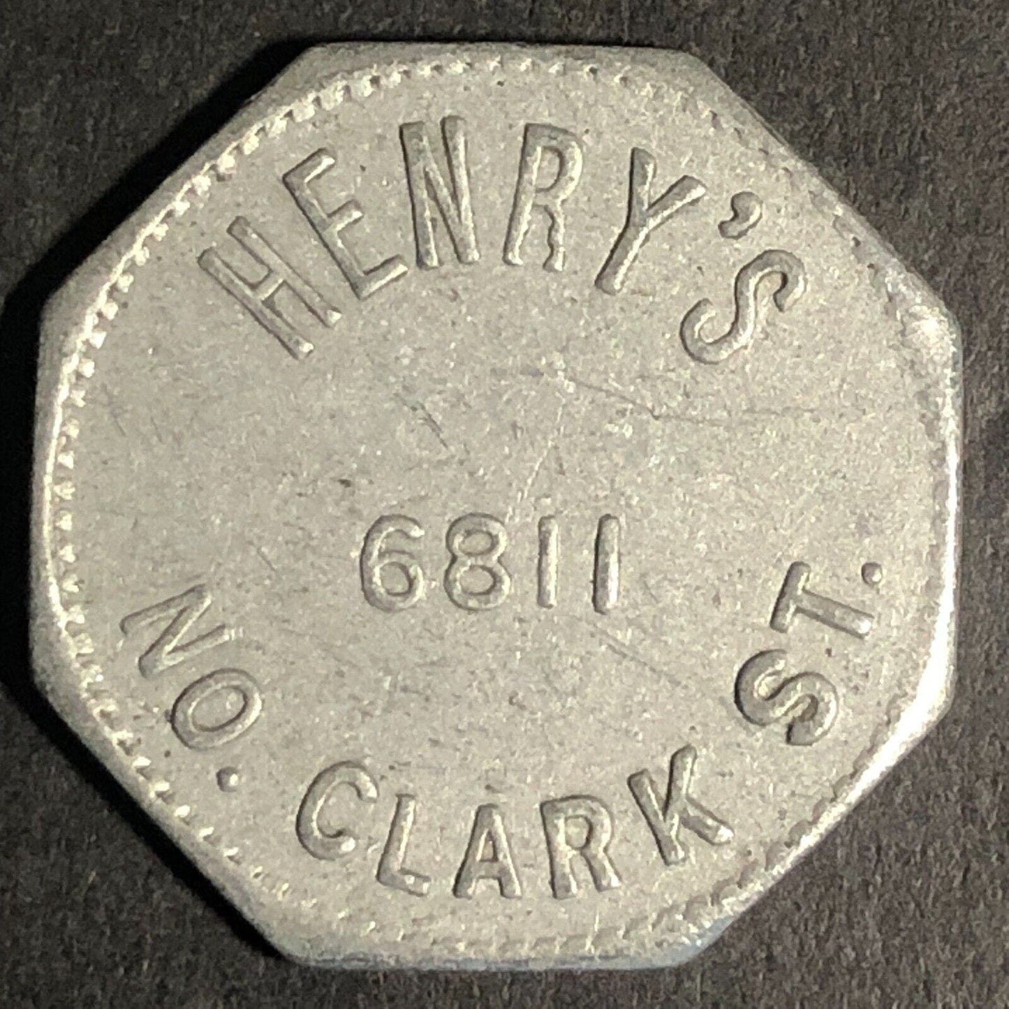 Henry's 6811 No. Clark St (Chicago) Alum G/F 10c Trade Token Hexagon 23mm