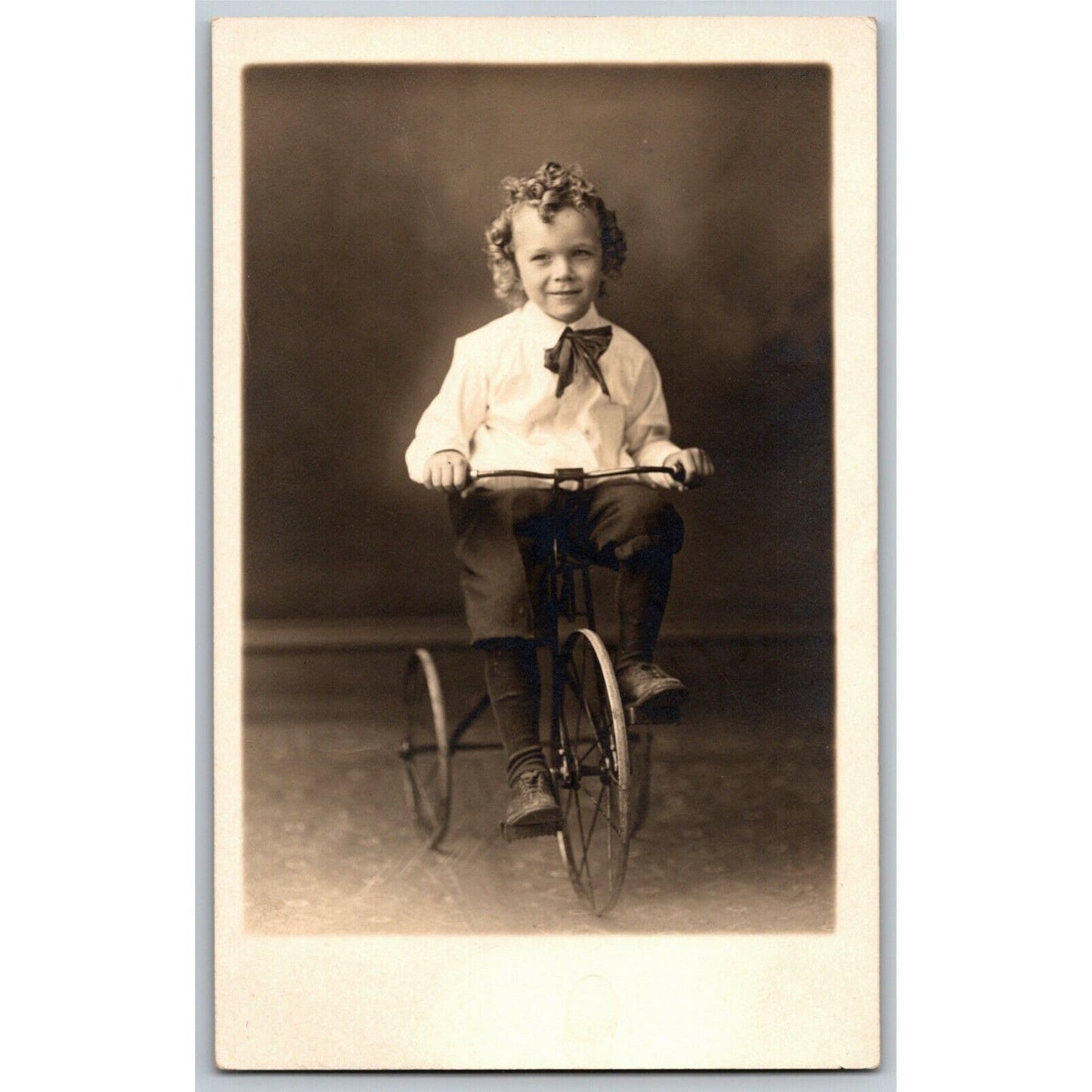 Vintage RPPC Postcard c1909 Child / Girl ? Posing / Riding Bicycle / Tricycle