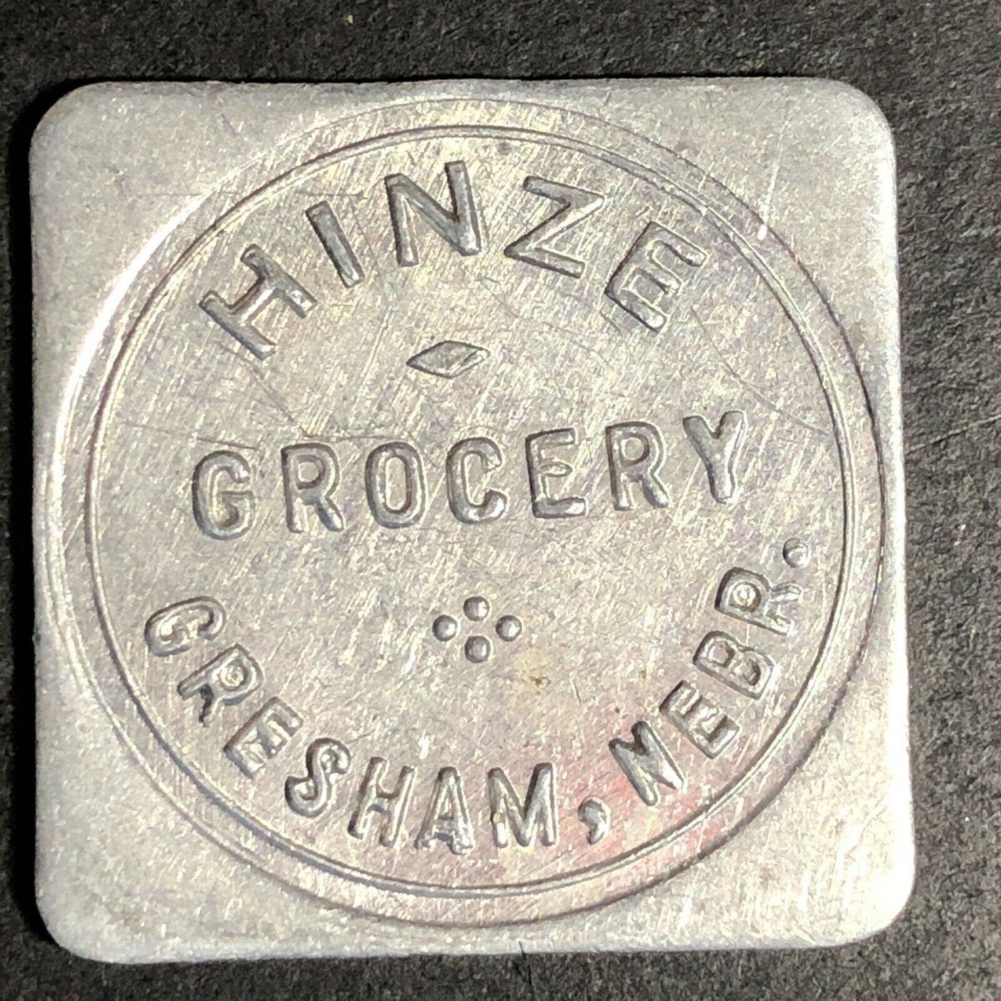 Hinze Grocery 28mm Aluminum Token "Good For 50c In Trade" Gresham, Nebraska