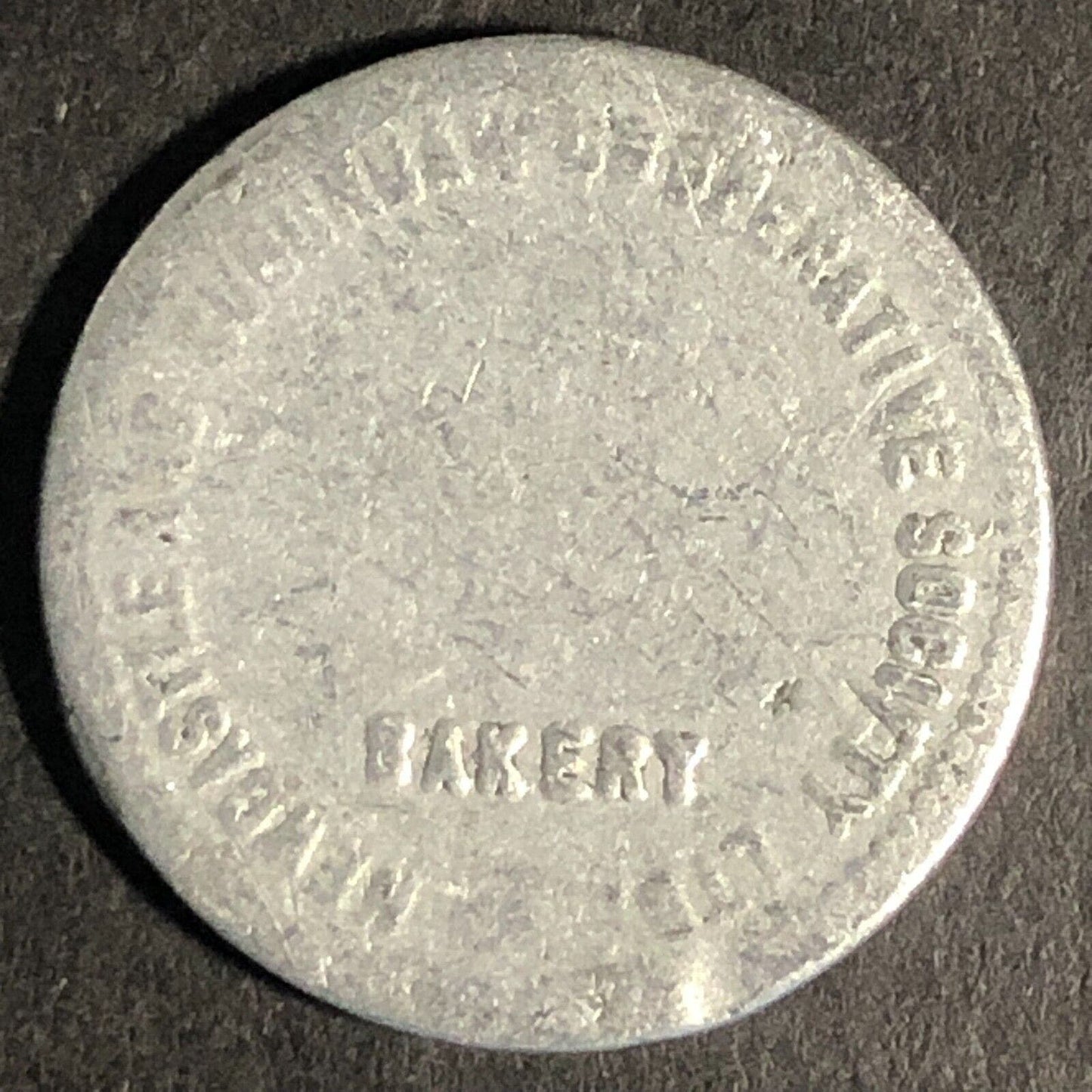 Newcastle Suburban Co-Operative Society Aluminum "Half Loaf" Bakery Token 21mm