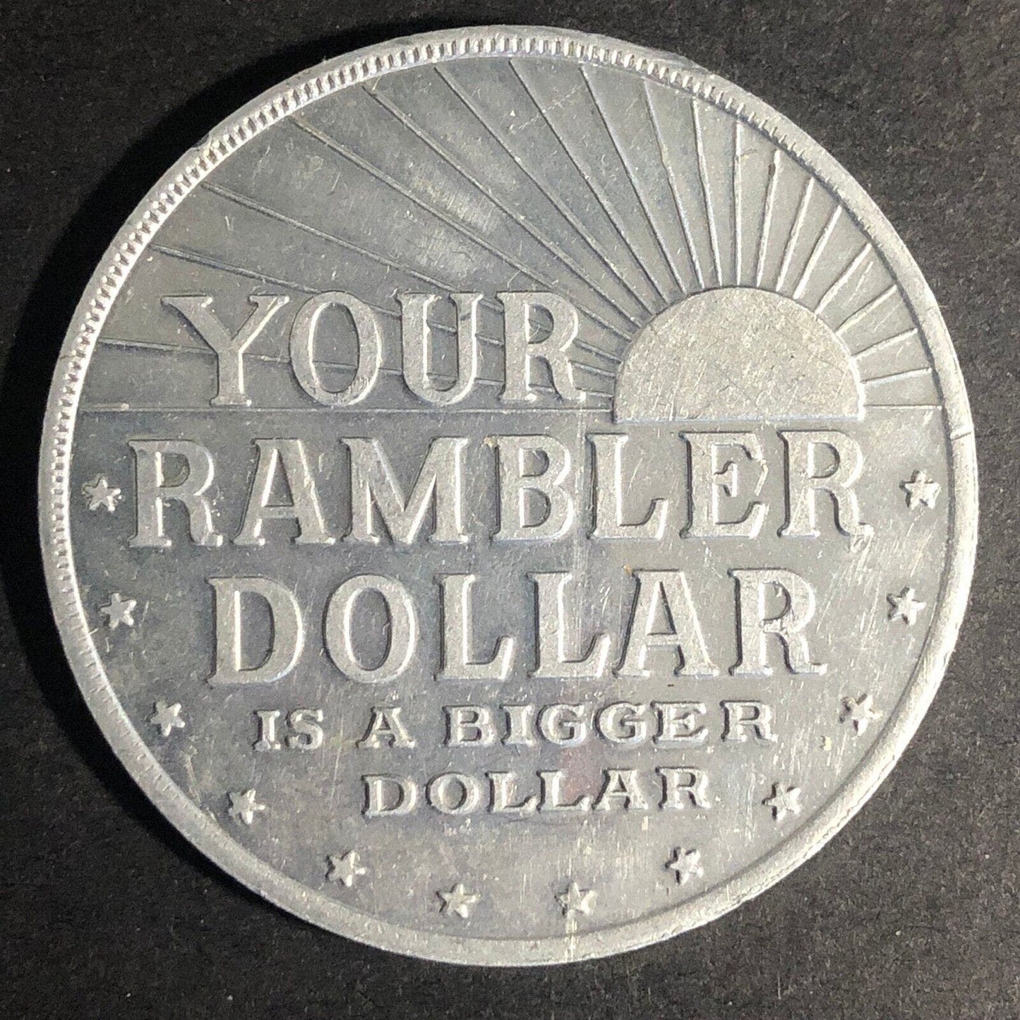 "Your Rambler Dollar is a Bigger Dollar" Alum. Token 45mm c1960 Scarce VGC