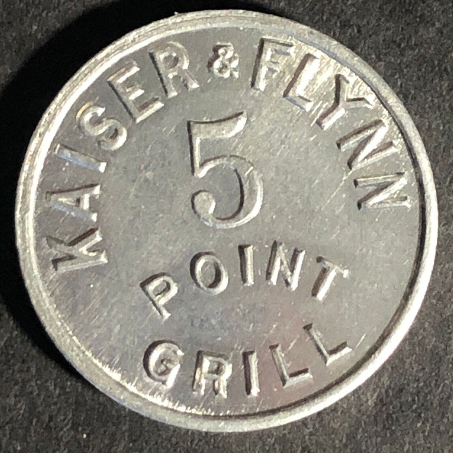 Kaiser & Flynn 5 Point Grill G/F 10c Alum Token 20mm - Unknown Scarce
