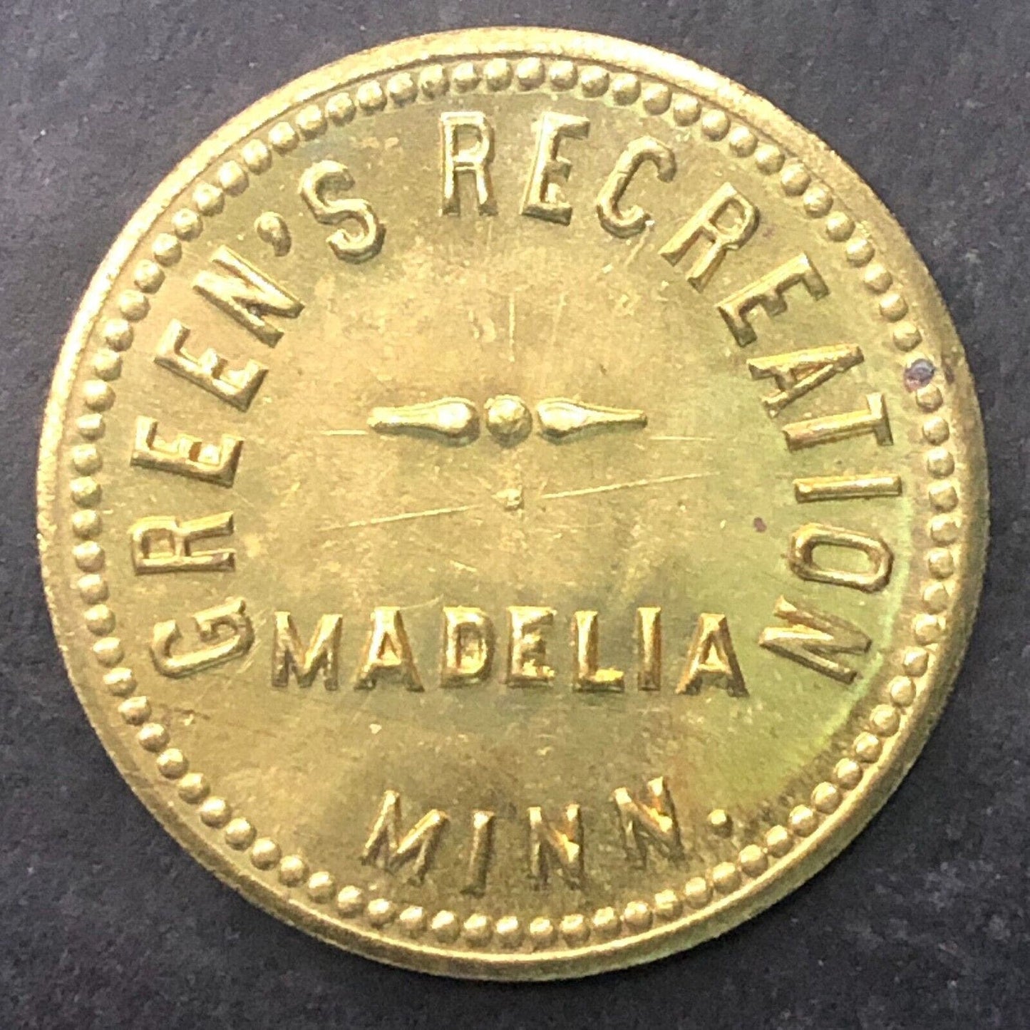 Madelia, MINN Green's Recreation G/F 10c Brass 25.5mm Scarce