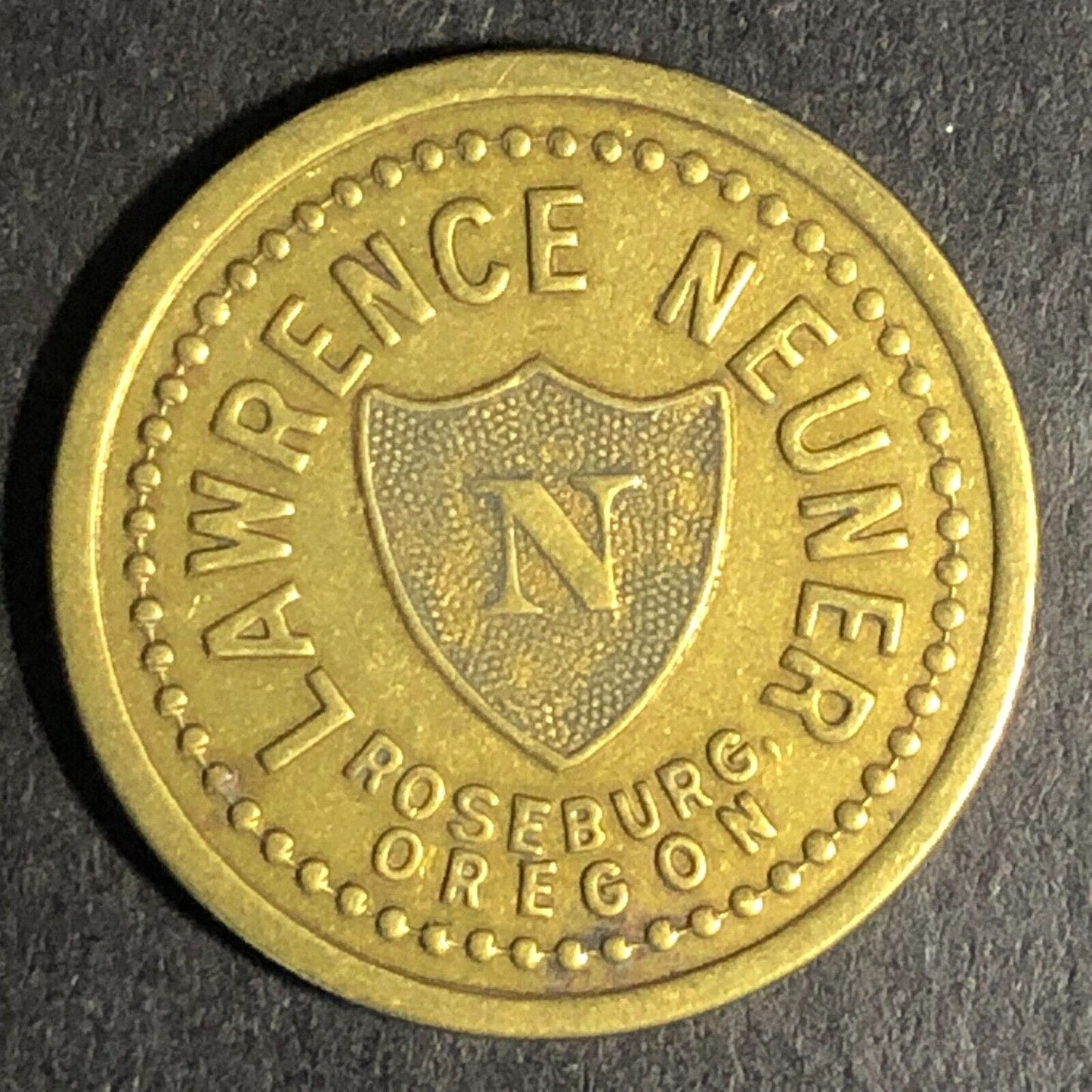 Lawrence Neuner Roseburg, ORE Cigar Store Brass G/F 5c Trade Token 21.2mm c1925