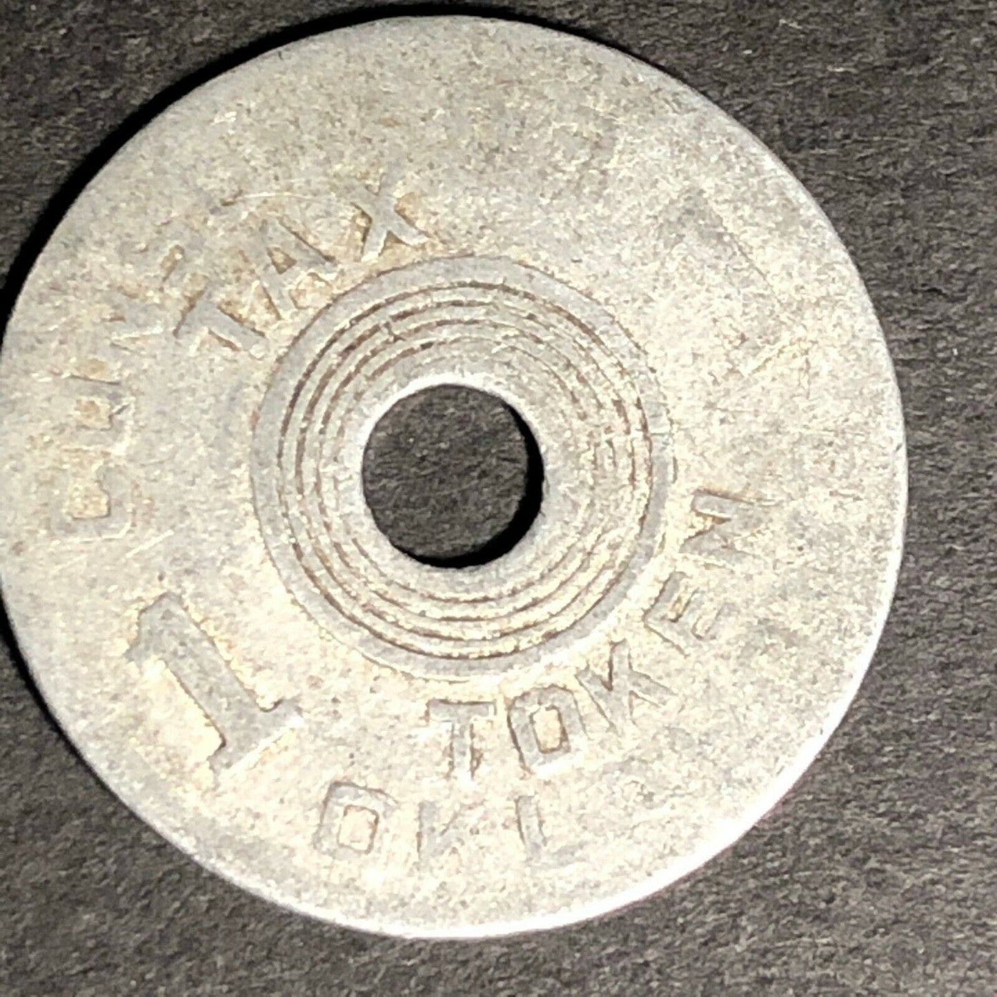 22.5mm Aluminum Consumer's Tax / Old Age Assistance "1" Token - Worn