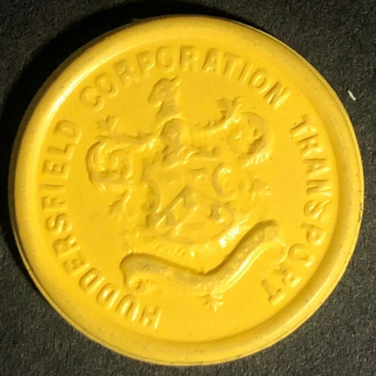 Huddersfield Transport England Plastic Token Yellow 1D 23mm c50's-60's
