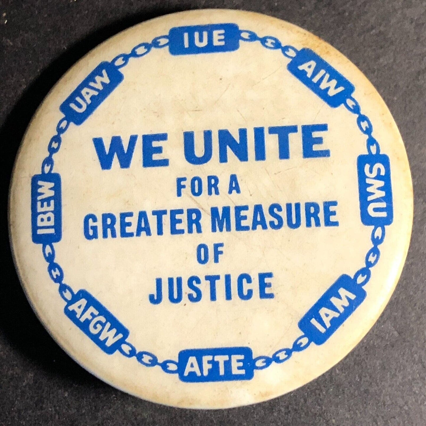 "We Unite..Justice" UAW IUE AIW AFTE IAM Union Steel Pinback Button c1950's-60's