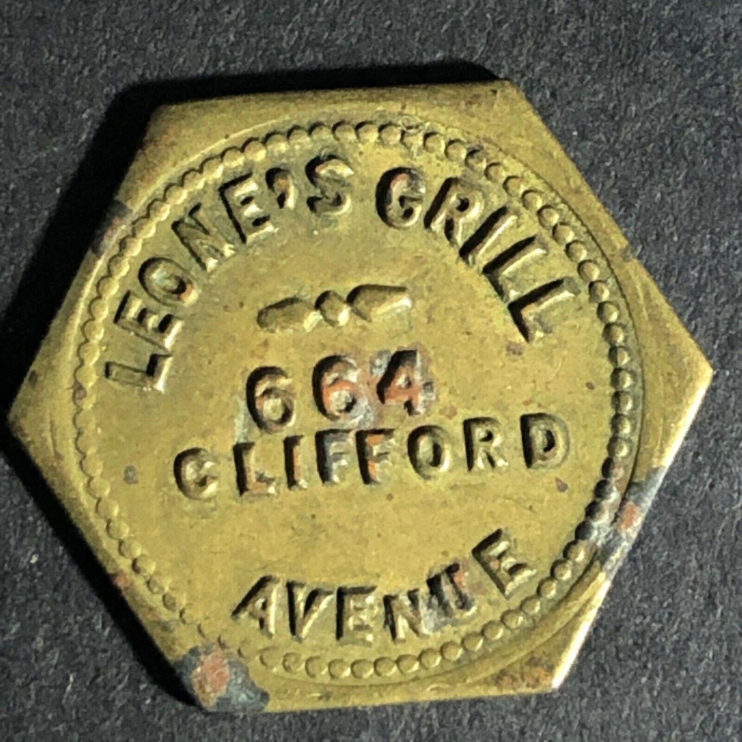 Leone's Grill (Rochester, NY) Brass Token - 20mm Hexagon c1944-48