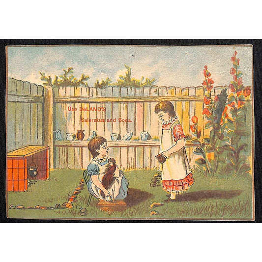 Deland's Saleratus and Soda Victorian Trade Card w/ Girls Tea & Doll in the Yard