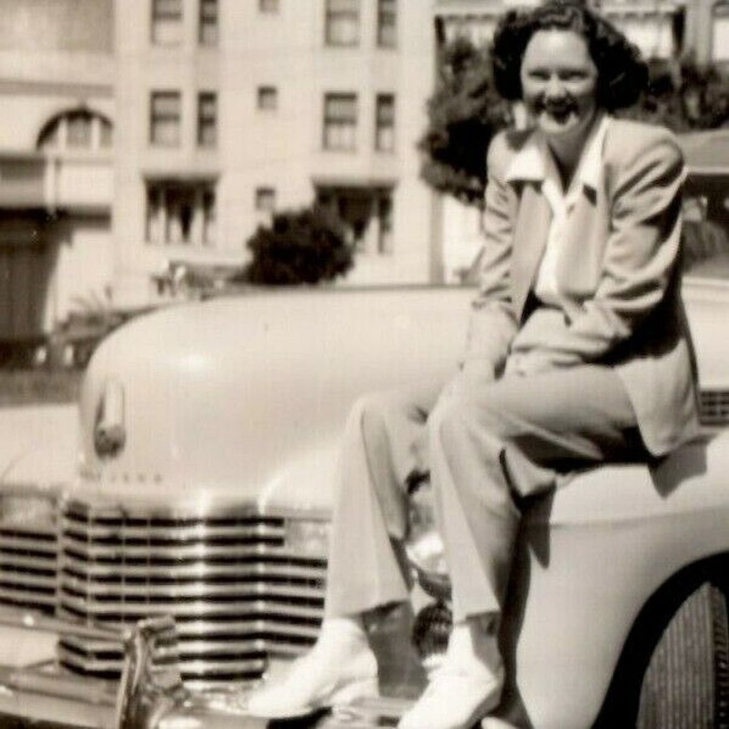 1941 B&W Photograph - Woman Sitting and Smiling on a Cadillac Series 63? VGC