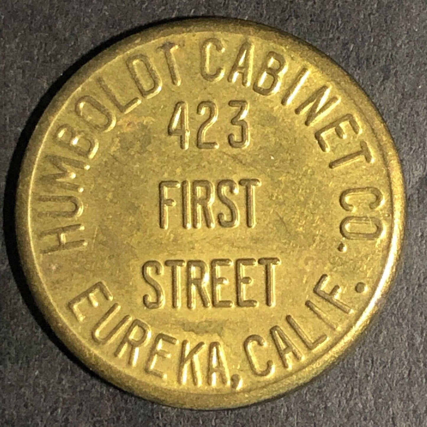 Humboldt Cabinet Co. Eureka, CALIF. Norton E. Steenfott Brass Trade Token 23mm