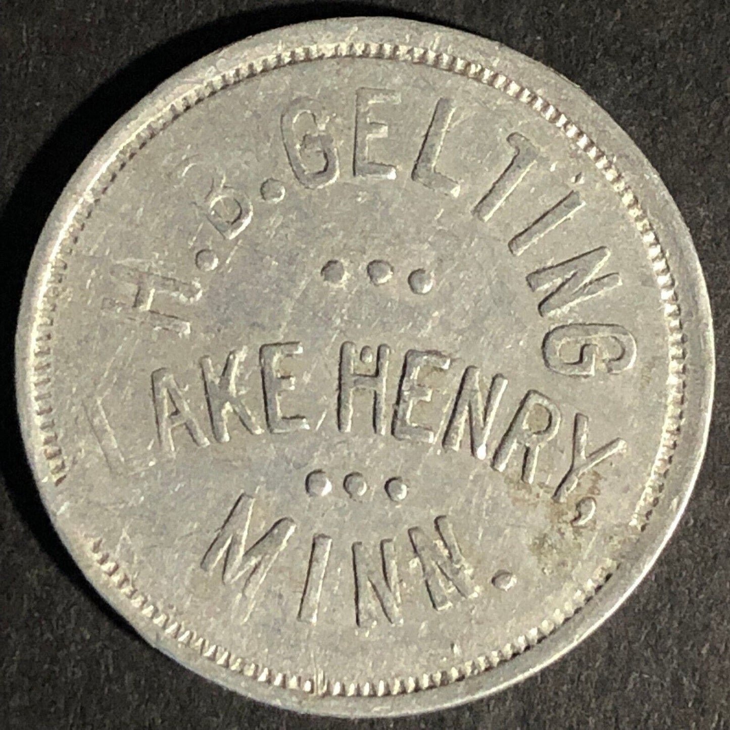 H.B Gelting - Lake Henry, Minn. G/F 25c In Trade Aluminum Token 26mm
