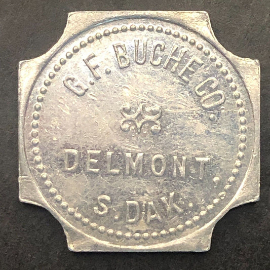 Delmont, SD "G.F. Buche Co." (Gen. Mdse.) G/F $1 Alum. Trade Token 25mm