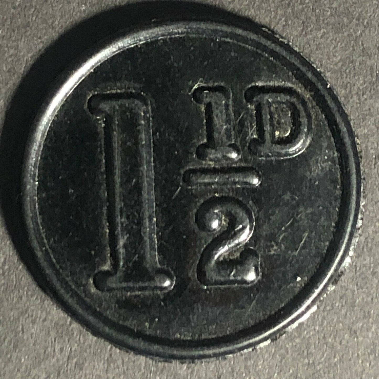 Ipswich England Plastic Transport Token Black 1 1/2D 21mm c50's-60's