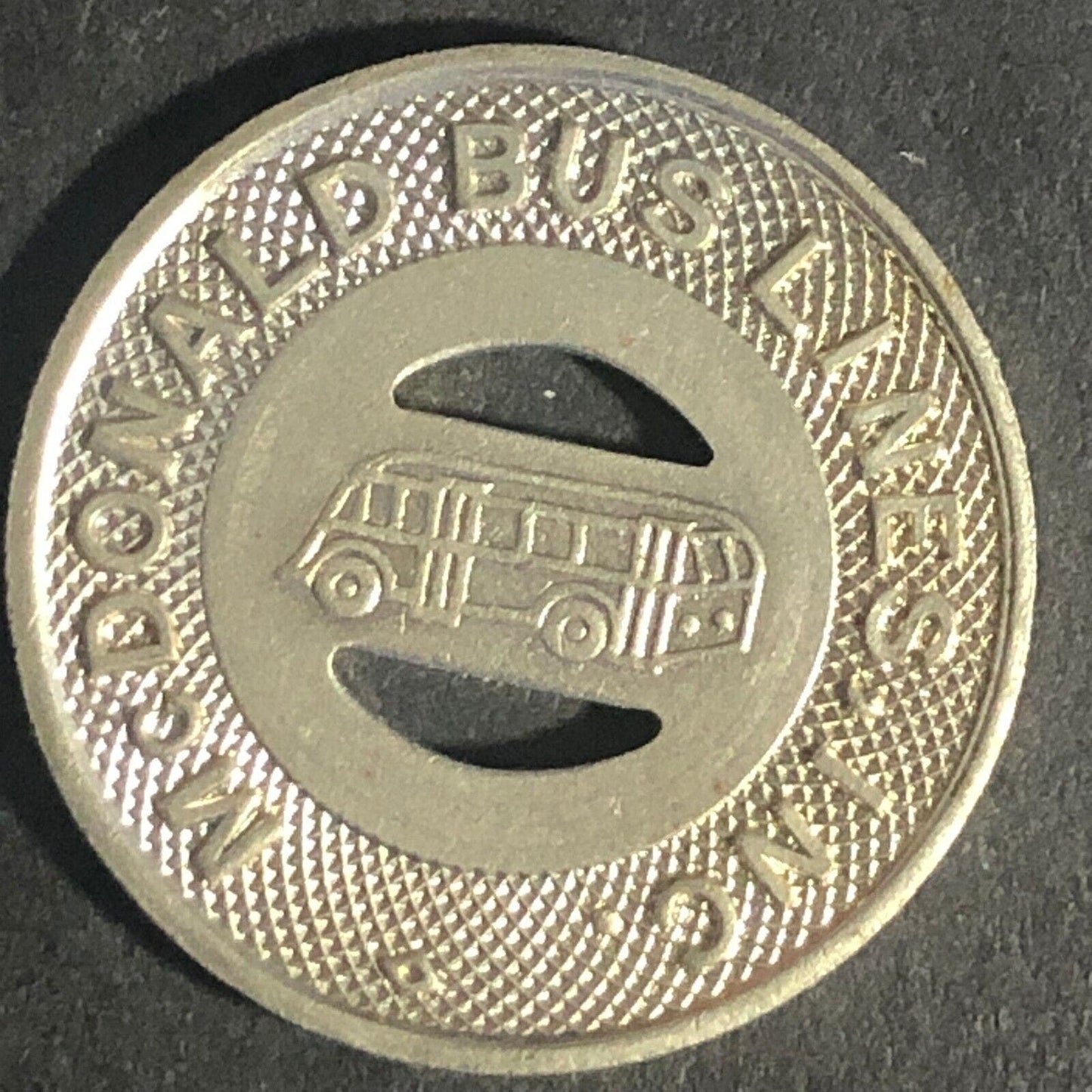 McDonald Bus Lines (Girald, OH) G/F One 15c Fare Transit WM Token 22.73mm