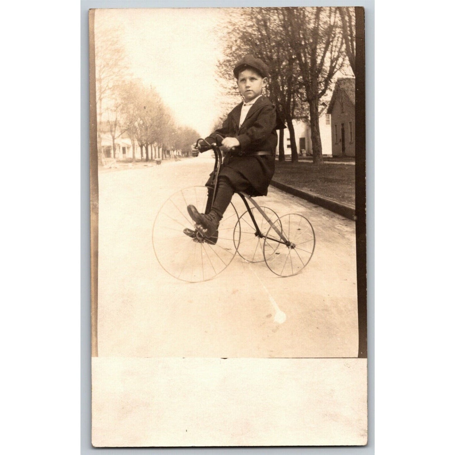 Vintage RPPC Postcard c1909 Child / Boy in Street Posing on Bicycle / Tricycle