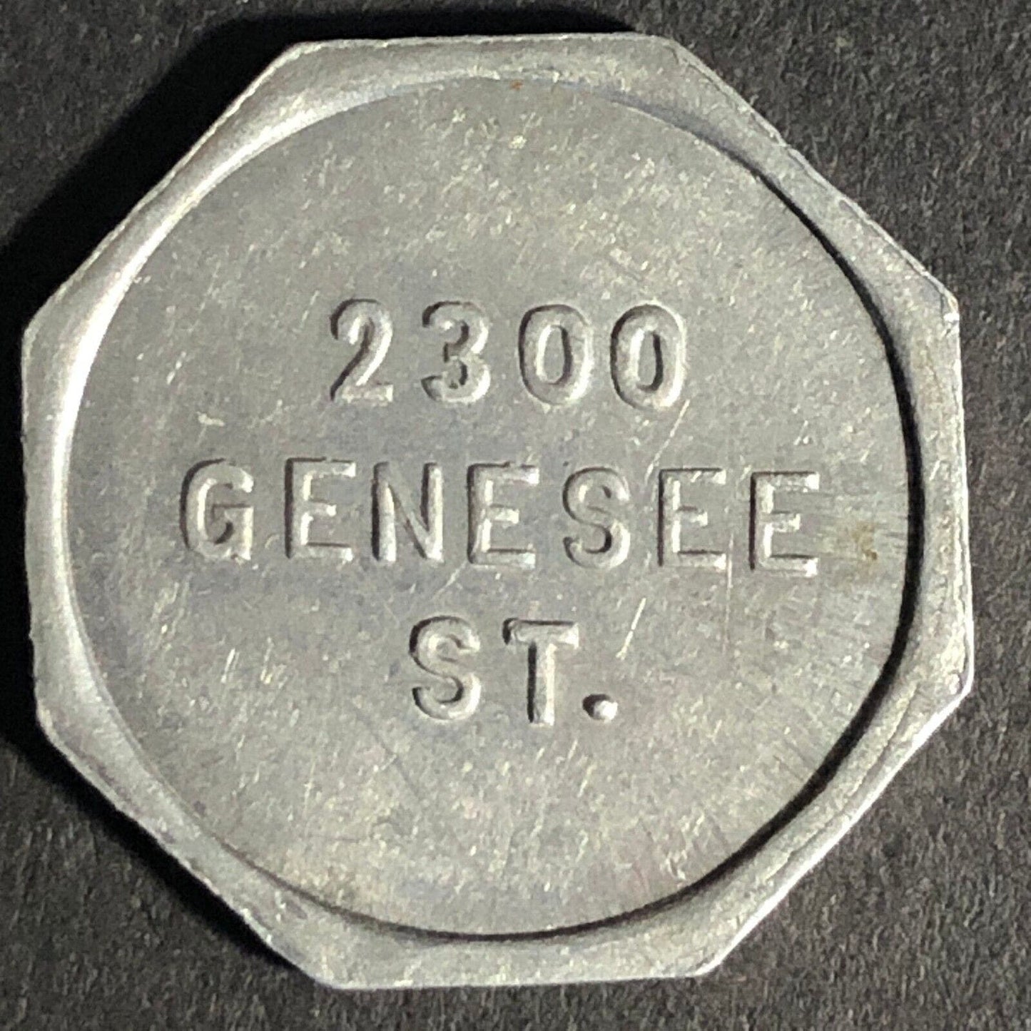 A.C. Gibson Co. 2300 Genesee St. Buffalo Alum. Receipt Token Octagon 22.59mm