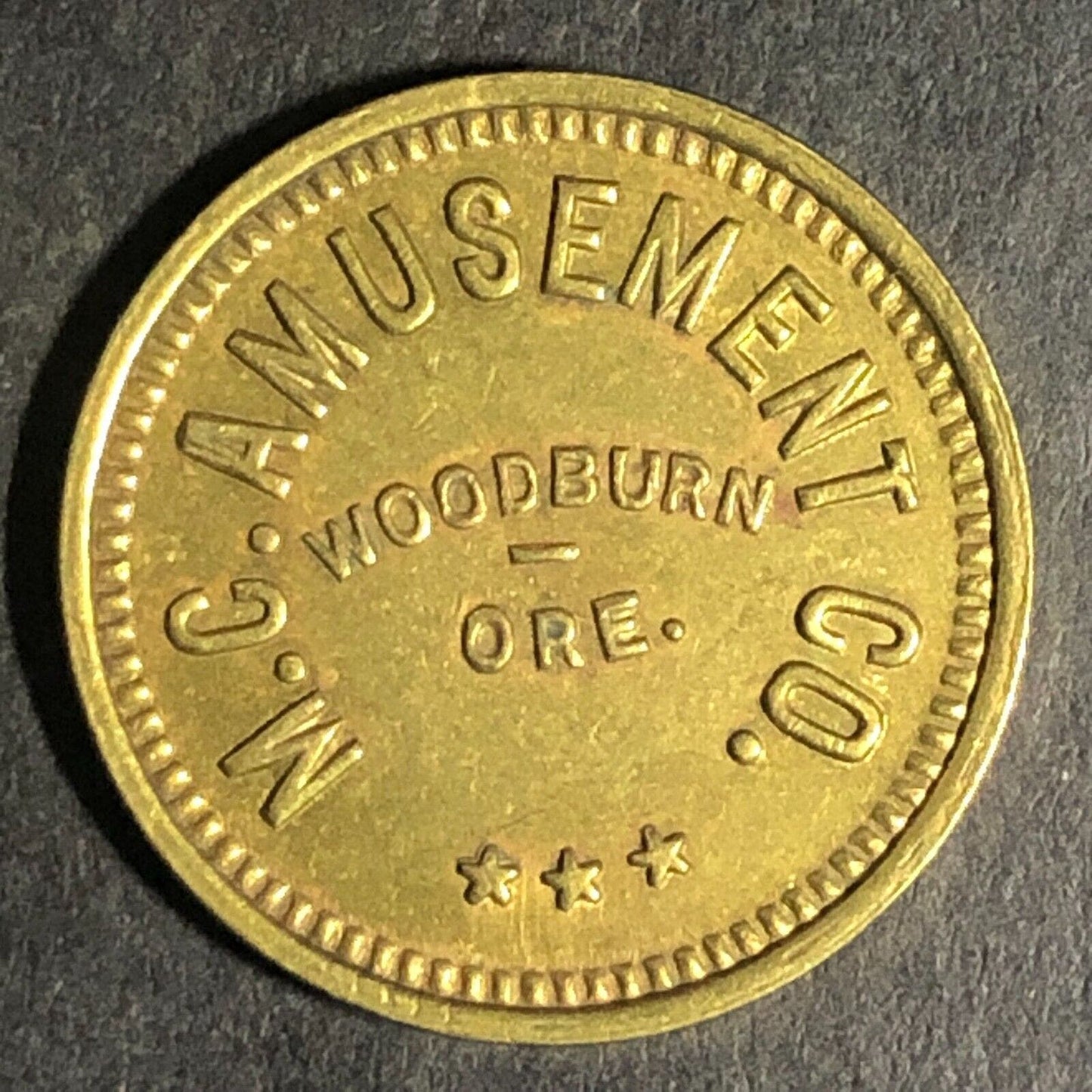 Woodburn, ORE M.C. Amusement Co. Brass Amusement Only" Trade Token 20mm