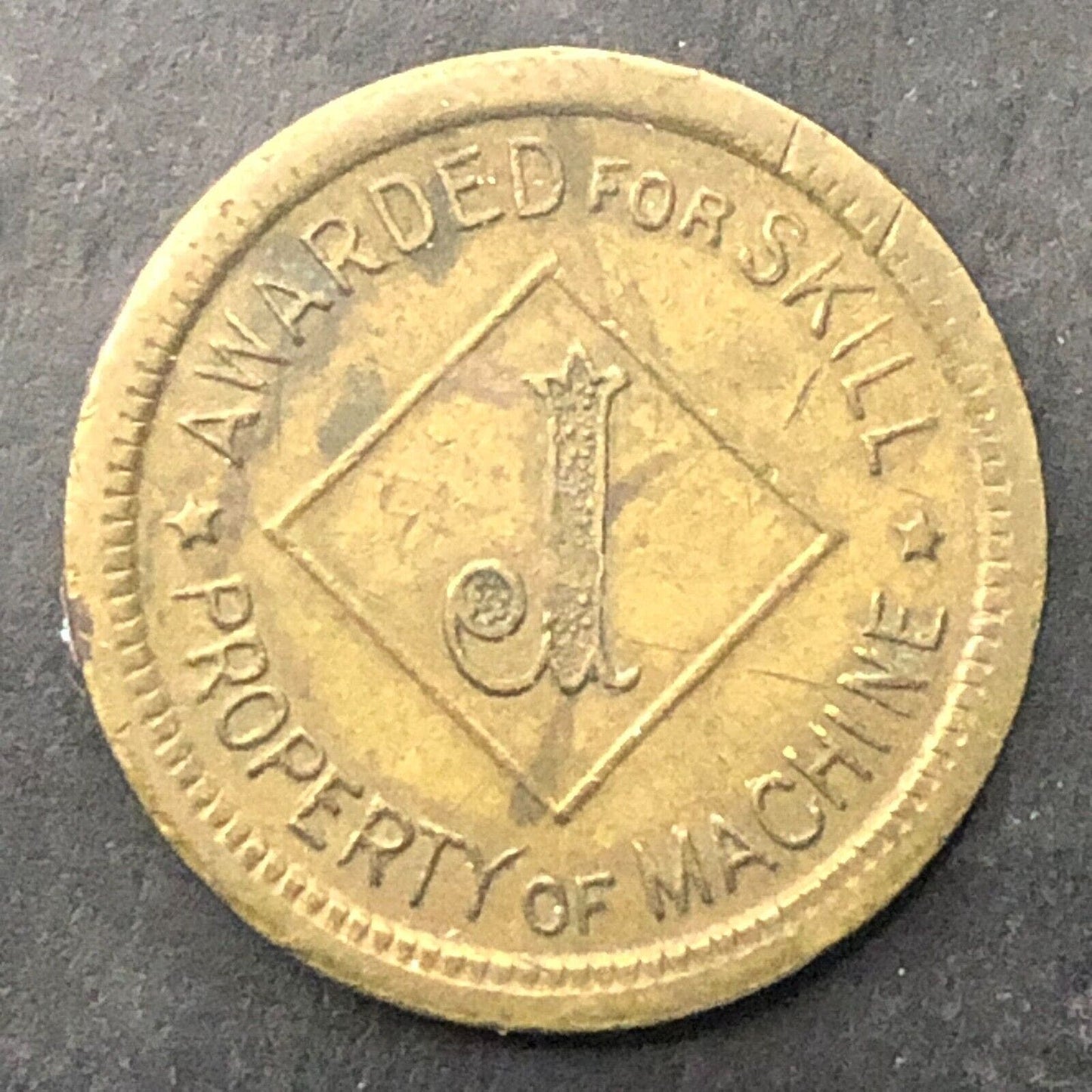 Awarded For Skill - Property of Machine Amusement "J" Token Brass 20mm