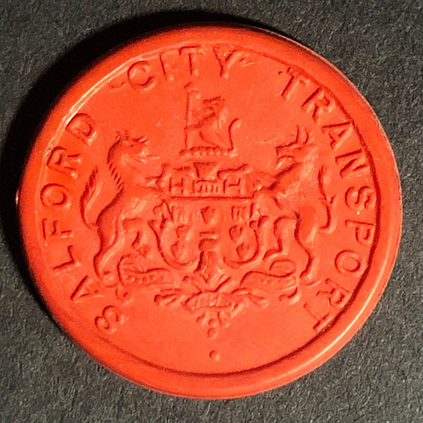 Salford City Transport England Plastic Token Red 1D 21mm c50's-60's