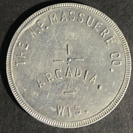 W.P. Massuere Co. Arcadia, Wis. G/F $1 In Merchandise Aluminum Token - 31mm