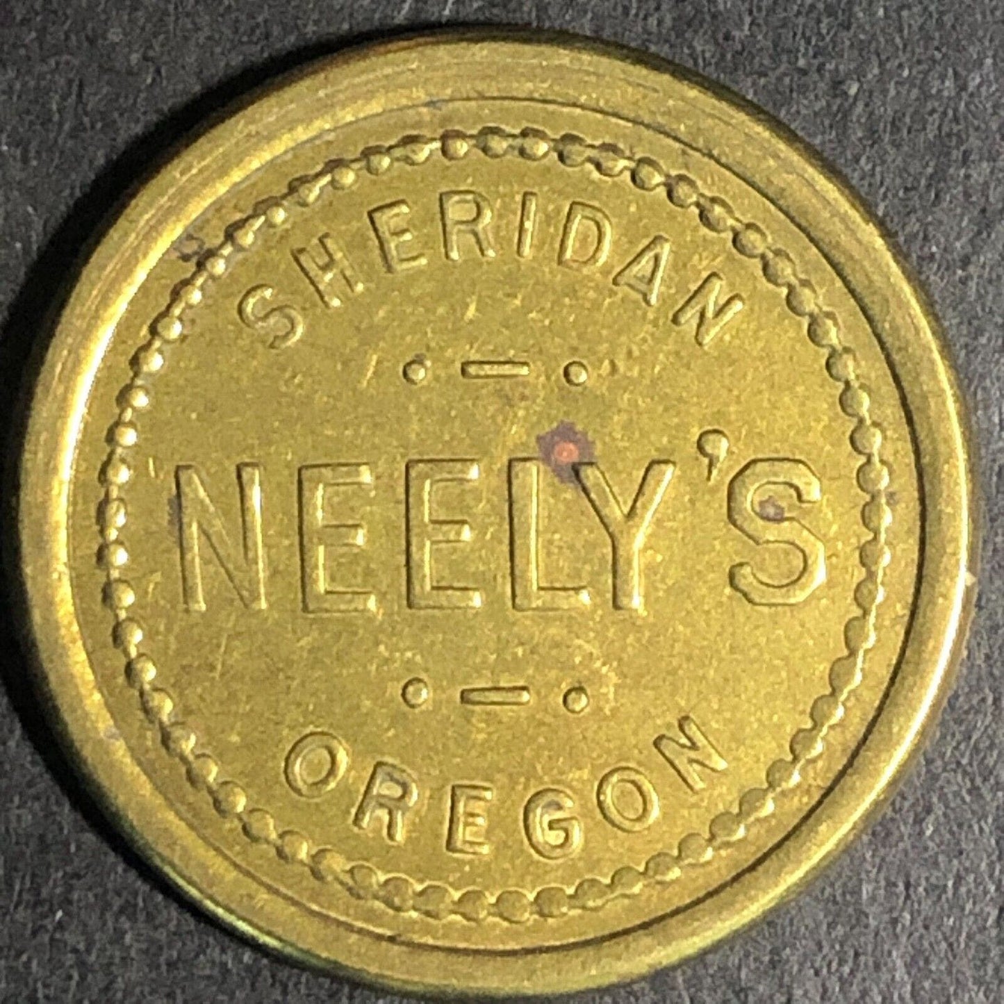Neely's Sheridan Oregon Brass G/F 5c Trade Token - 22mm