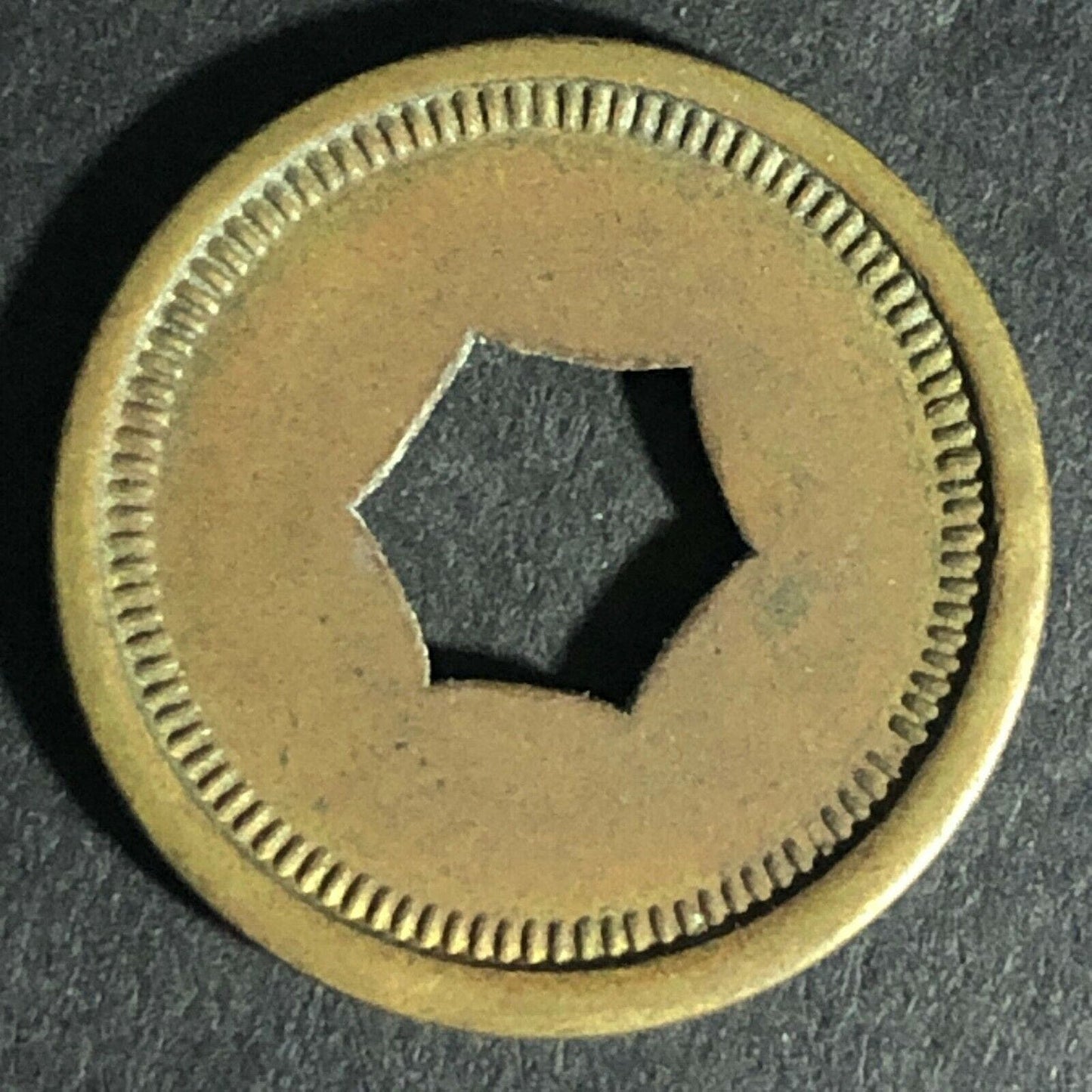 "Good For 5c Package Fruit Gum" Token (Watling Mfg. Chicago) Hexagon Cut 21.3mm